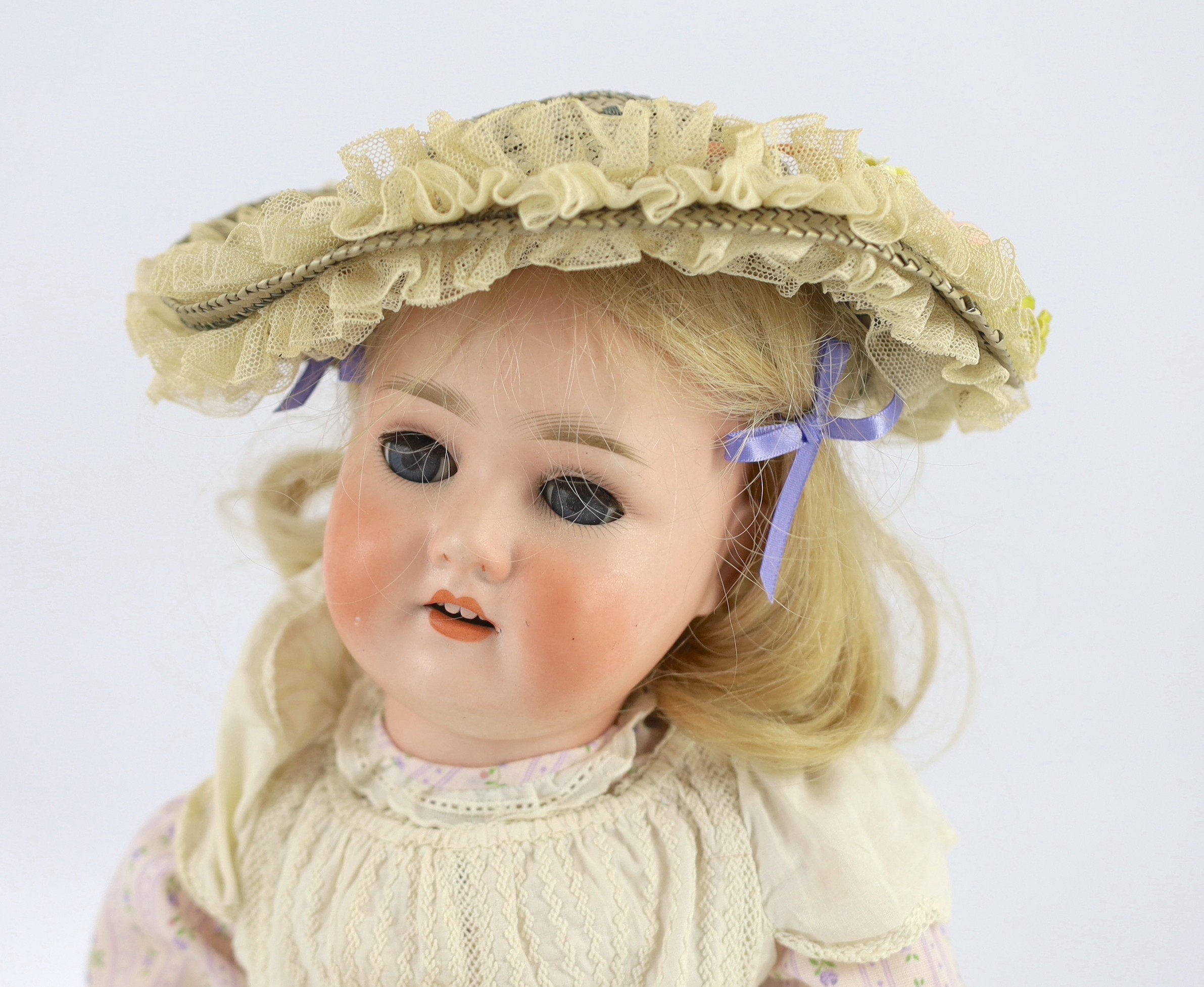 A Schoenau & Hoffmeister bisque doll, German, circa 1909, 21in.